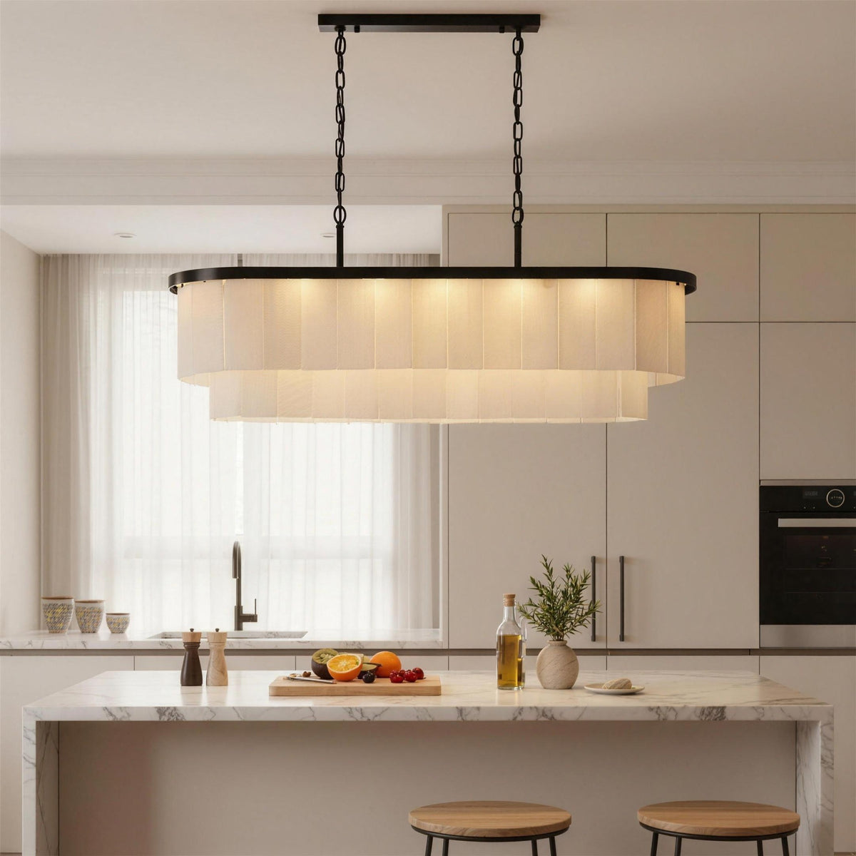 Velo Alabastro linear chandelier above a white kitchen island