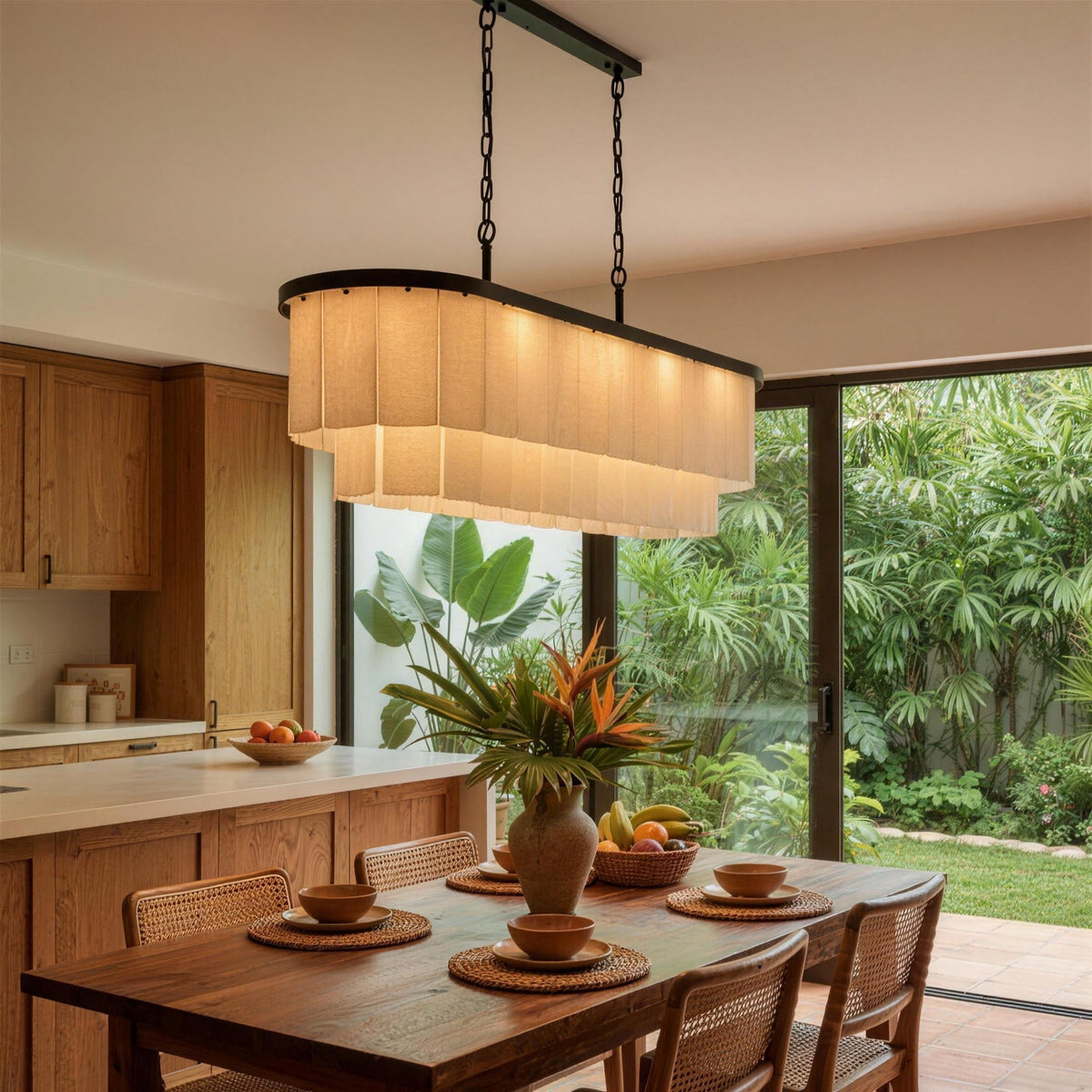Velo Alabastro chandelier over a dining table with a garden view