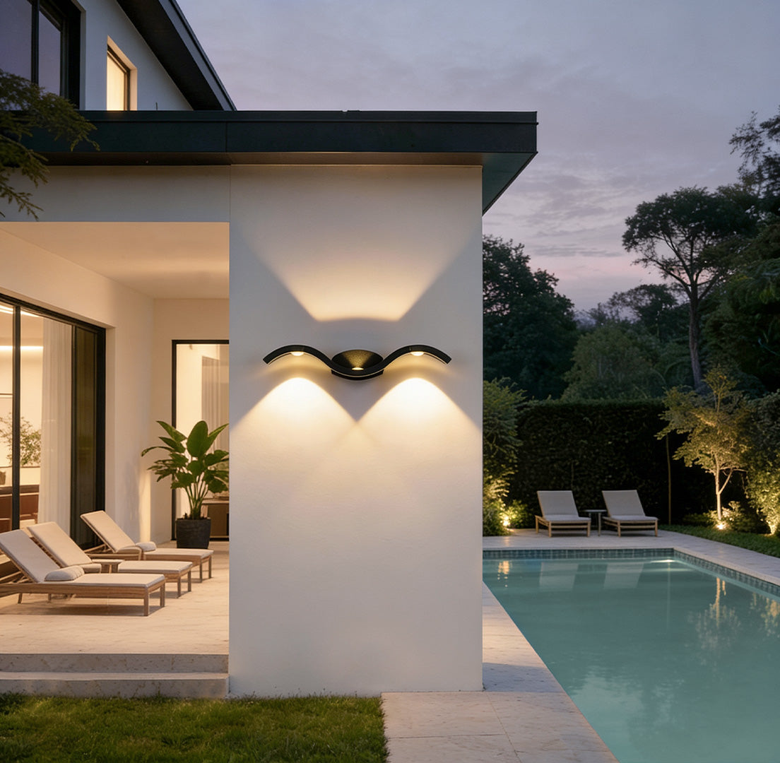 https://cdn.shopify.com/s/files/1/0556/5382/6742/files/wave-wall-sconce-modern-outdoor-patio-light.jpg?v=1767081429