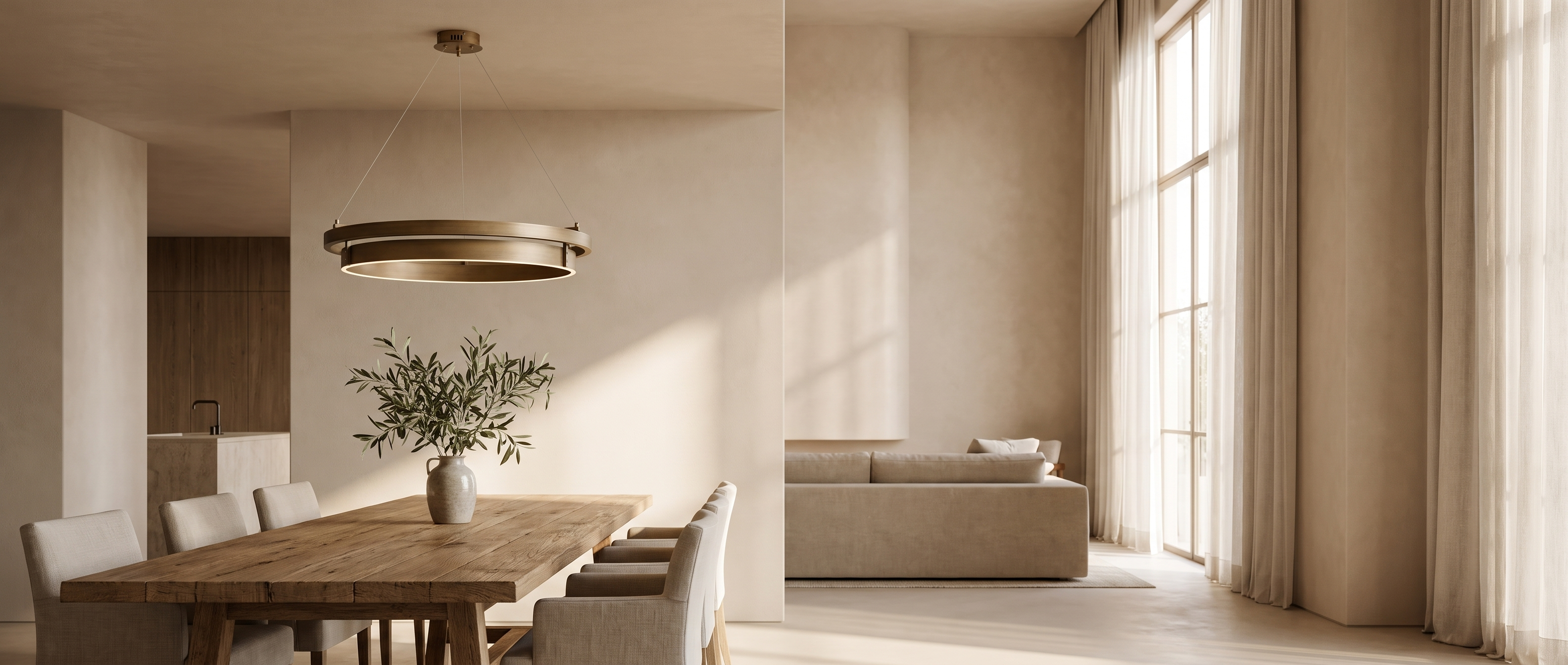 Anelli Sospesi double ring chandelier above a dining table in a bright open-plan living space