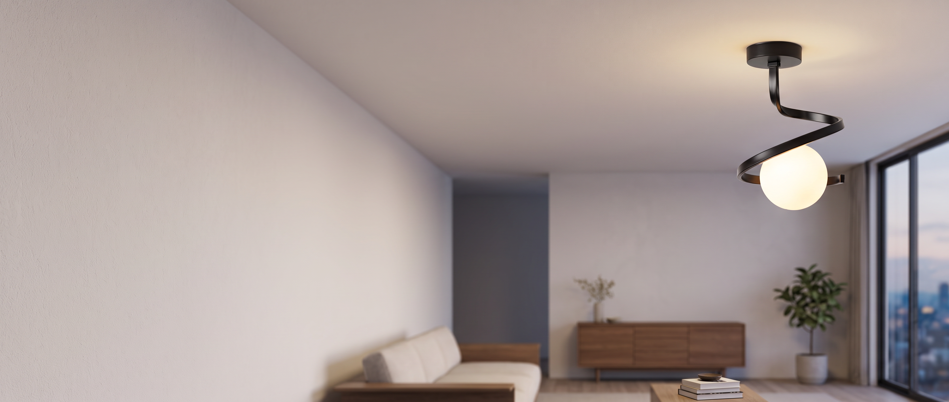 Spirale Lunare black spiral ceiling lamp glowing in a serene interior